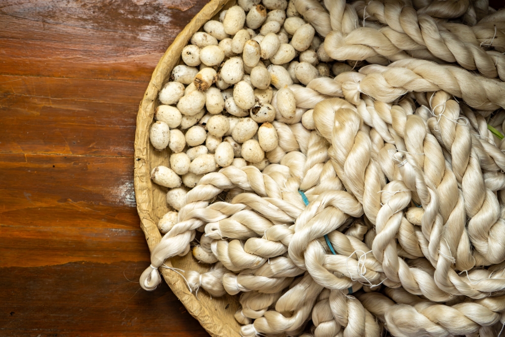 A,Basket,Filled,With,Delicate,Silk,Threads,Intertwined,With,Silkworm