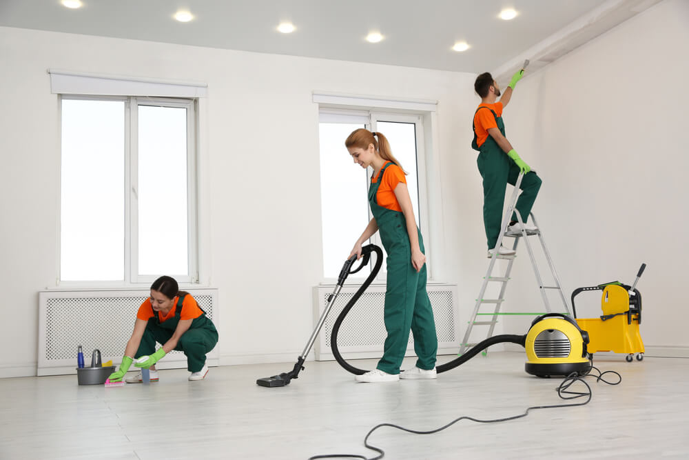 A staff deep cleaning small apartment shines